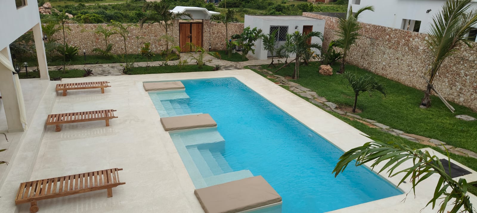 Luxurious swimming pool with premium finishes, RGB lighting, and eco-friendly salt water system